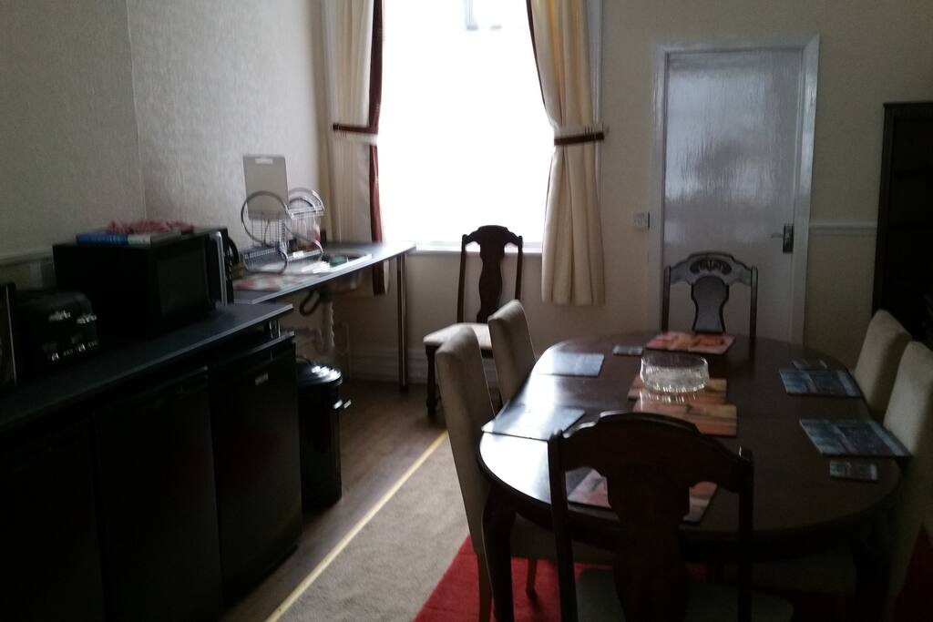 guest dining room with kettle , toaster , fridge and microwaves with grill facility