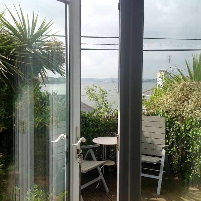 French doors from bedroom to private terrace somewhere to unwind with a glass of wine after sightseeing.