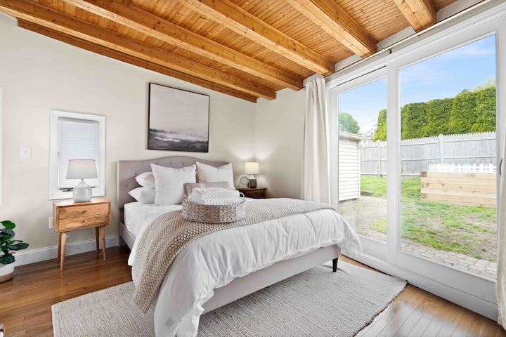 Main bedroom: queen bed, dresser, rolling clothing rack, full length mirror, cooling pillows (regular & firm), quilt, comforter, extra blankets. Mini split with heat & AC. Sliders to back patio with black out curtains. USB outlets in nightstand