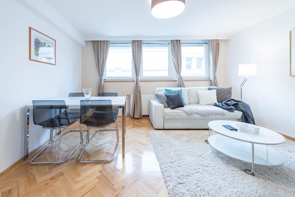 Living room with dining area and pull-out sofa bed