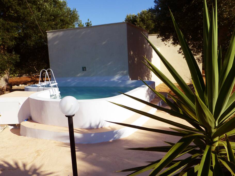 Pool terrace area which also has a BBQ area.