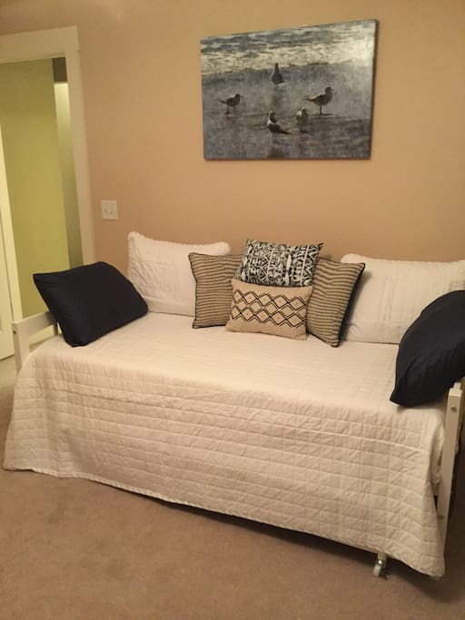 Second guest room with twin beds, with trundle. Nice place to read a book in the afternoon.