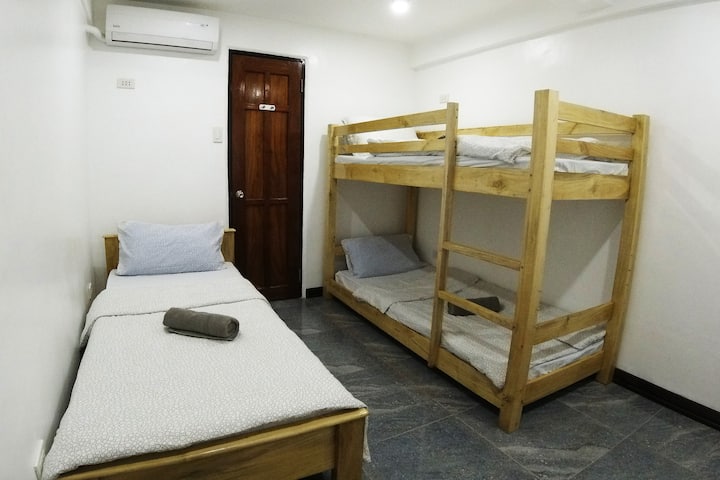The bedroom on the first floor of the gardenhouse - with split type air-condition. and a private bathroom.