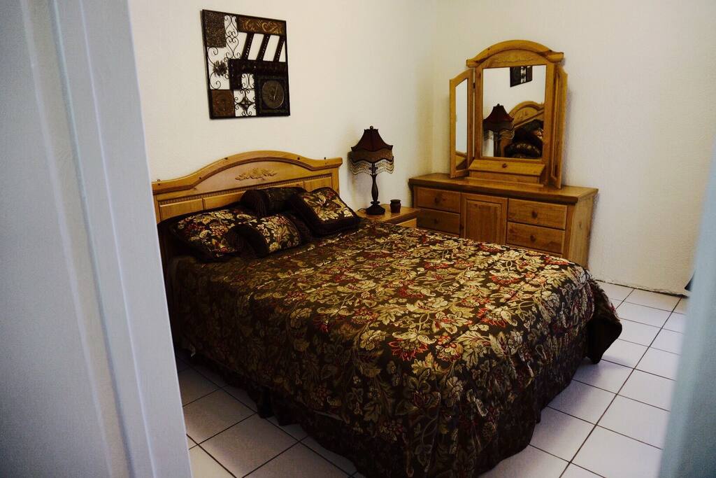 Master bedroom with queen mattress