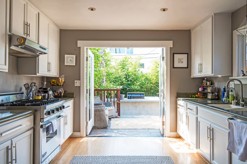 Chef's kitchen opens to backyard