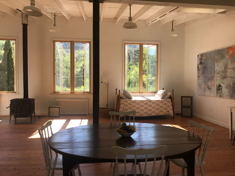 living/drawing area with daybed. outstanding light (all windows now with curtains)
