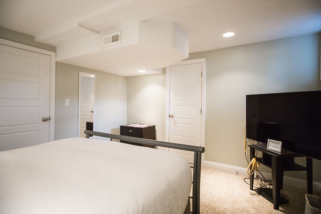 Room comes with dresser, night stand tables on either side, bedside lamp, fire extinguisher, TV, and DVD player