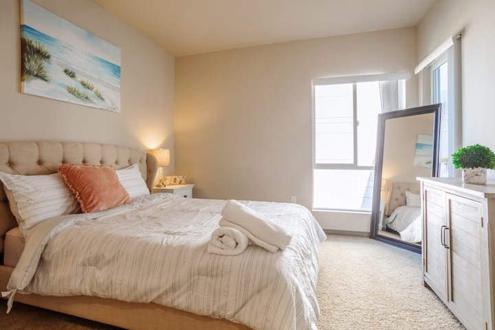 Bright bedroom featuring a premium queen bed 