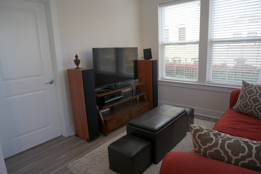 A 50" TV with polk audio floor standing speakers