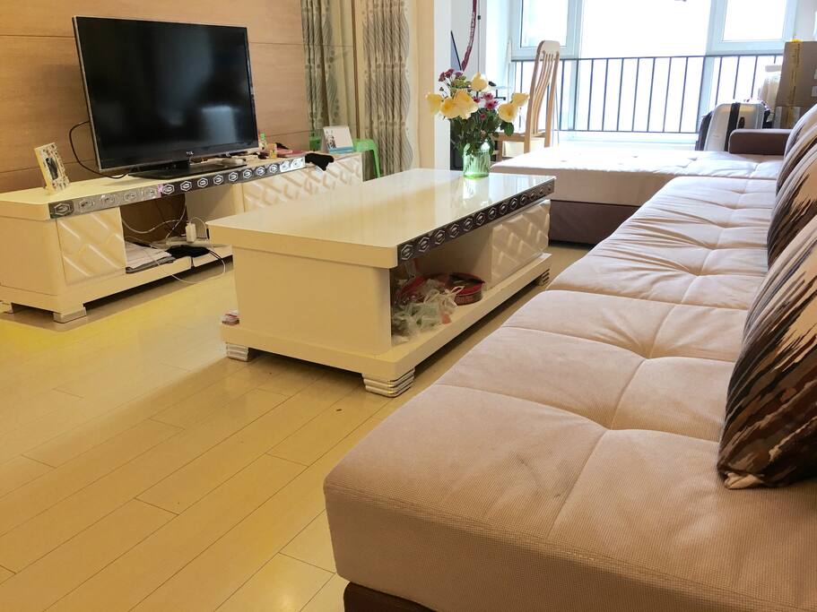 Large living room with TV and plenty of storage space