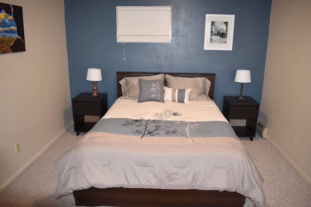 Queen size bed with drawers underneath.