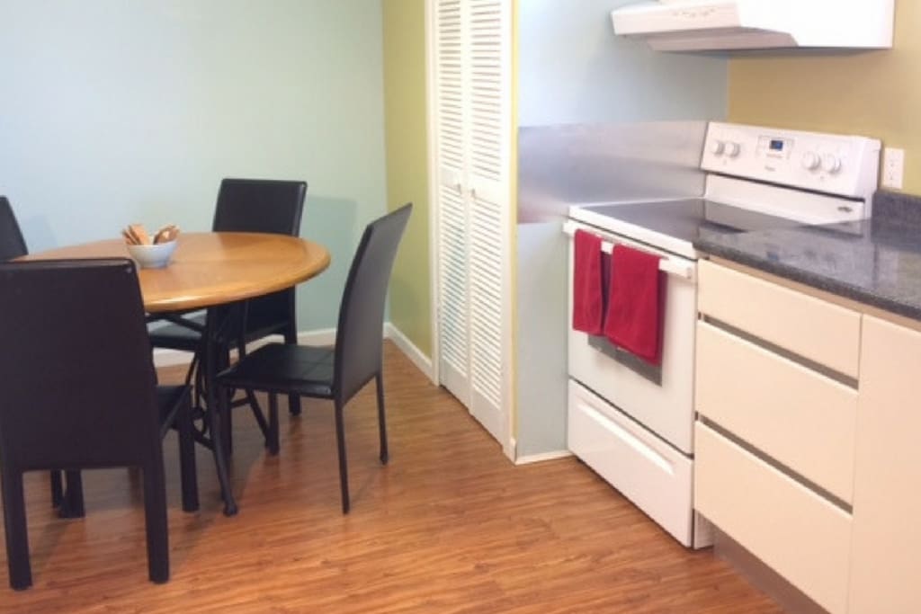 Large, fully equipped kitchen with dining table.