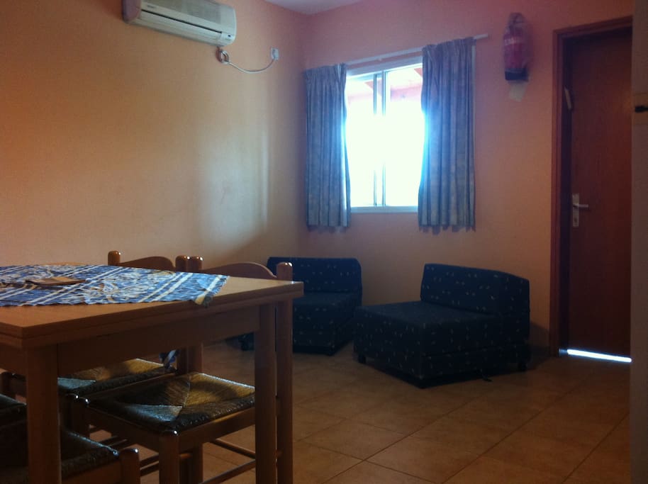 Central space includes kitchen, dining area & TV.