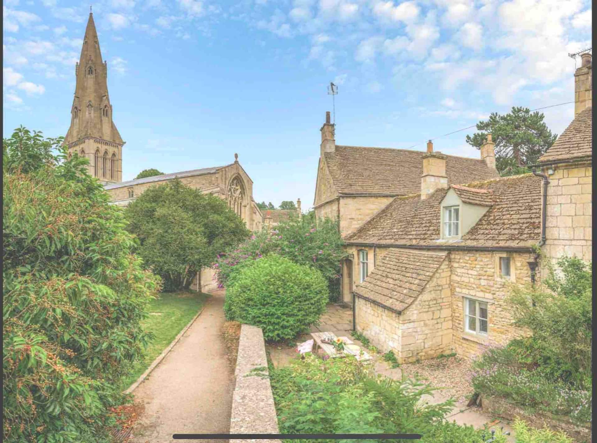 Churchyard Ketton stone cottage next to the pub