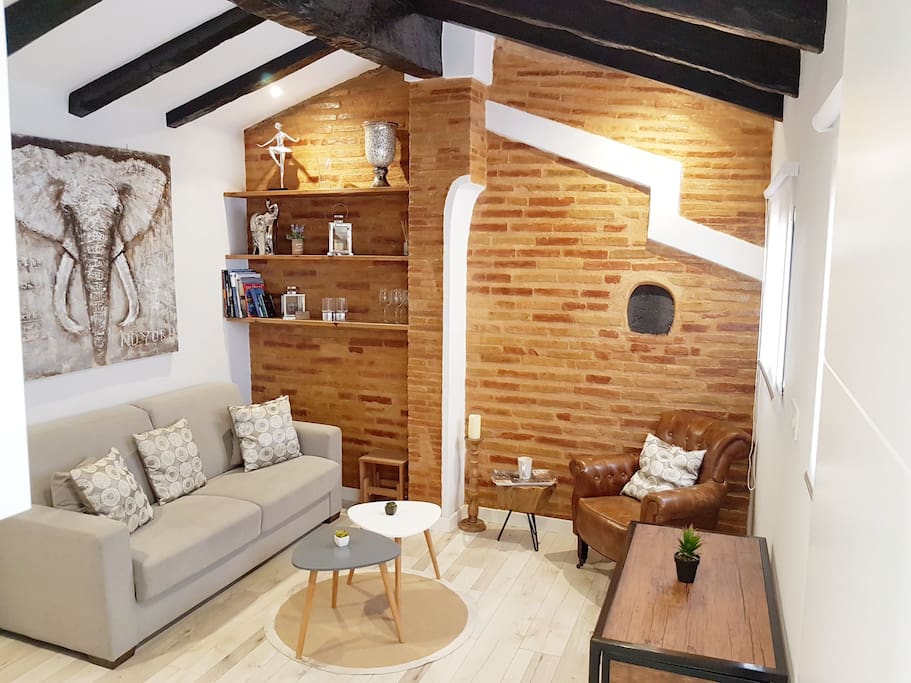 salon with old beams and traditional stone