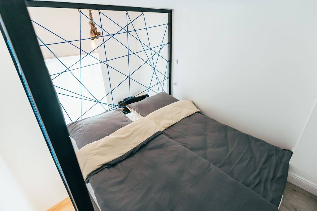 The double bed upstairs in the mezzanine