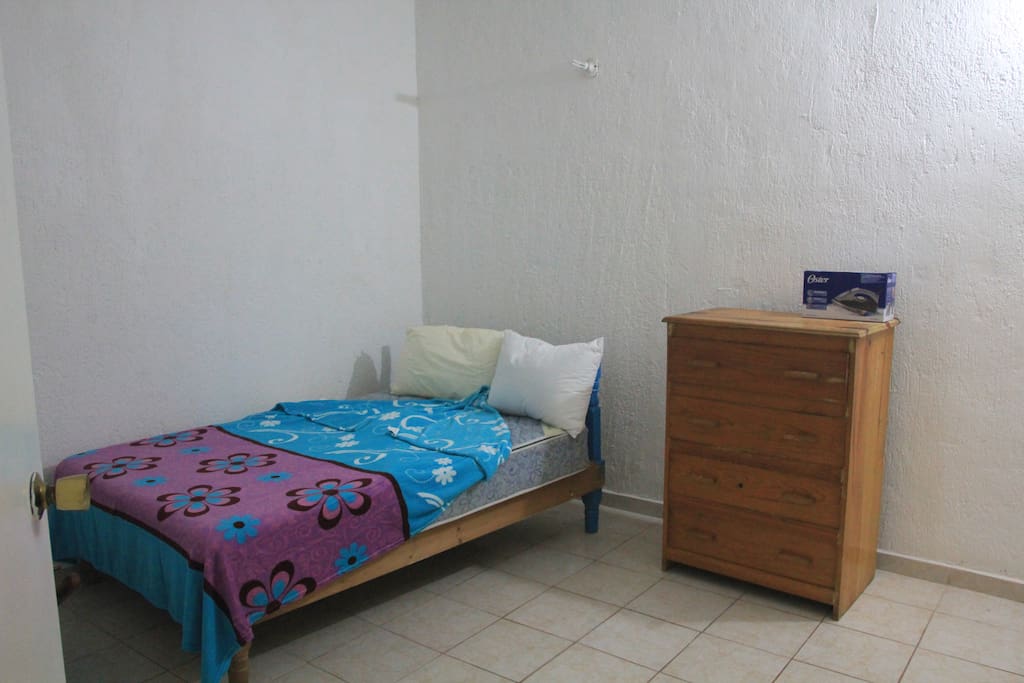 The bedroom, which has a full-size bed.