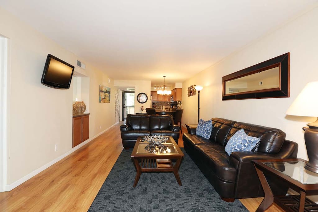 Open floor plan with mounted flat screen TV.