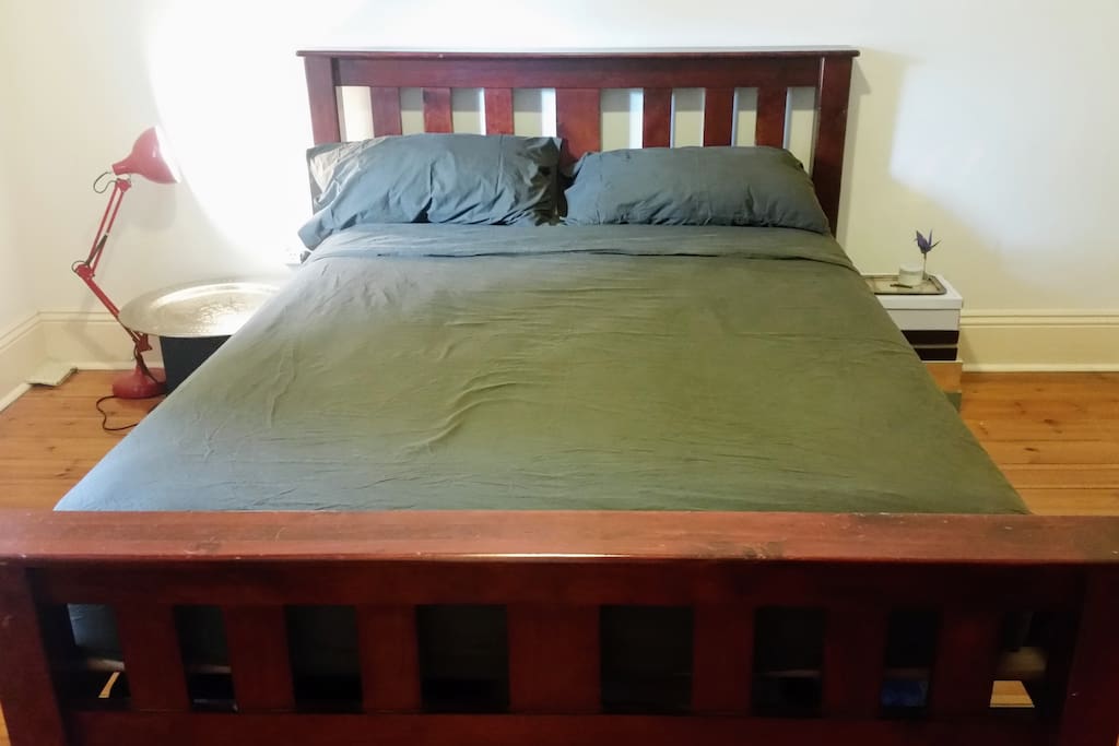 Queen sized bed in the spacious master bedroom