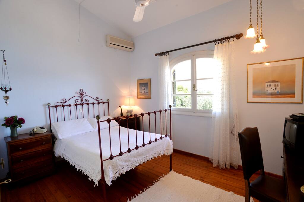 The senior bedroom with the old antic bed and the magnificent view