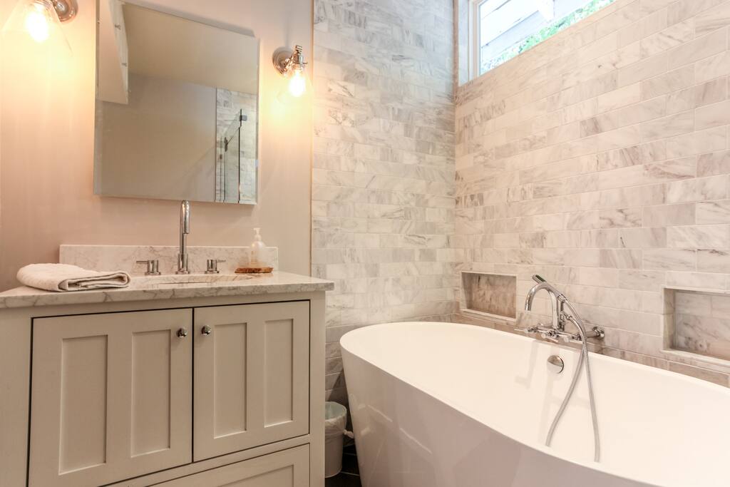 brand new bathroom with huge japanese style soaking tub and rain shower