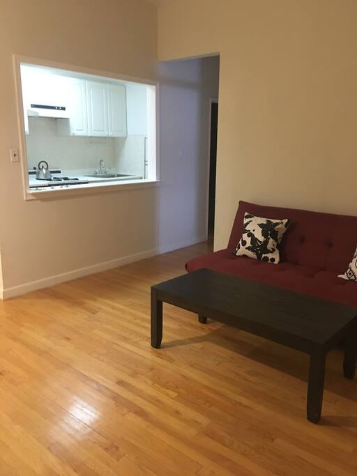 living room with window into kitchen