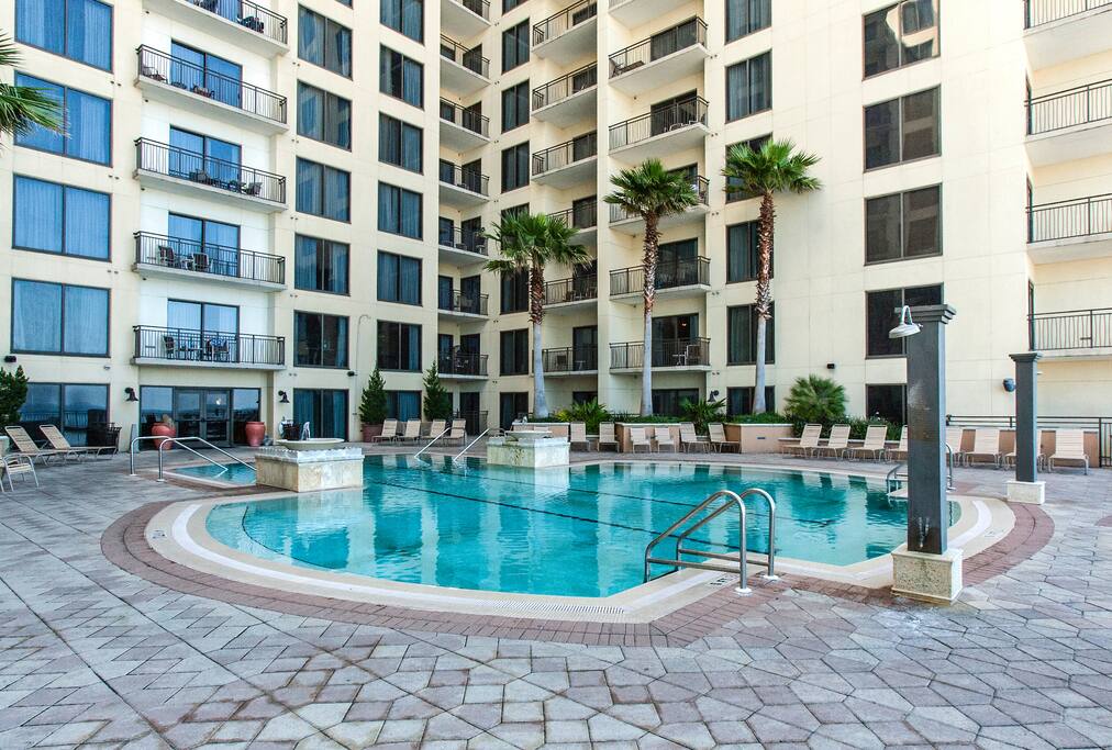 Outdoor pool with tons of seating for soaking up the sun.