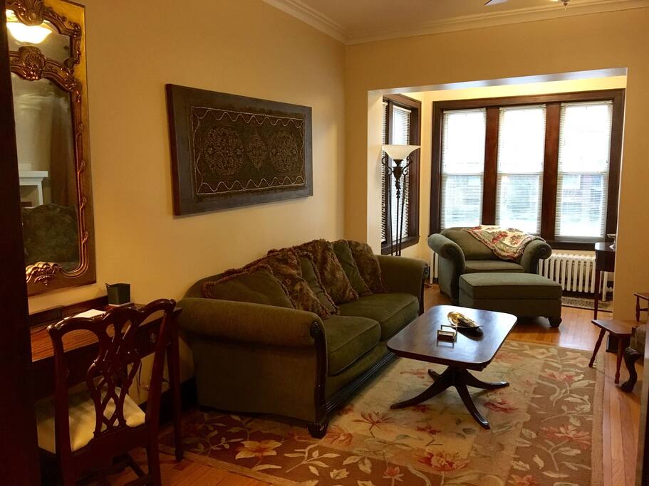 Desk, comfy couch, and over-sized chair in reading nook
