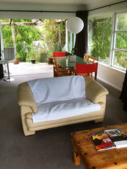 View from lounge, past dining room, with sliding doors which open completely to the large deck and back lawn & garden