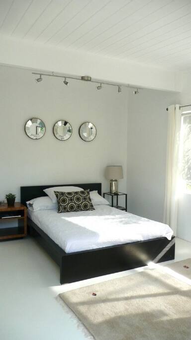 Bedroom with queen sized bed.