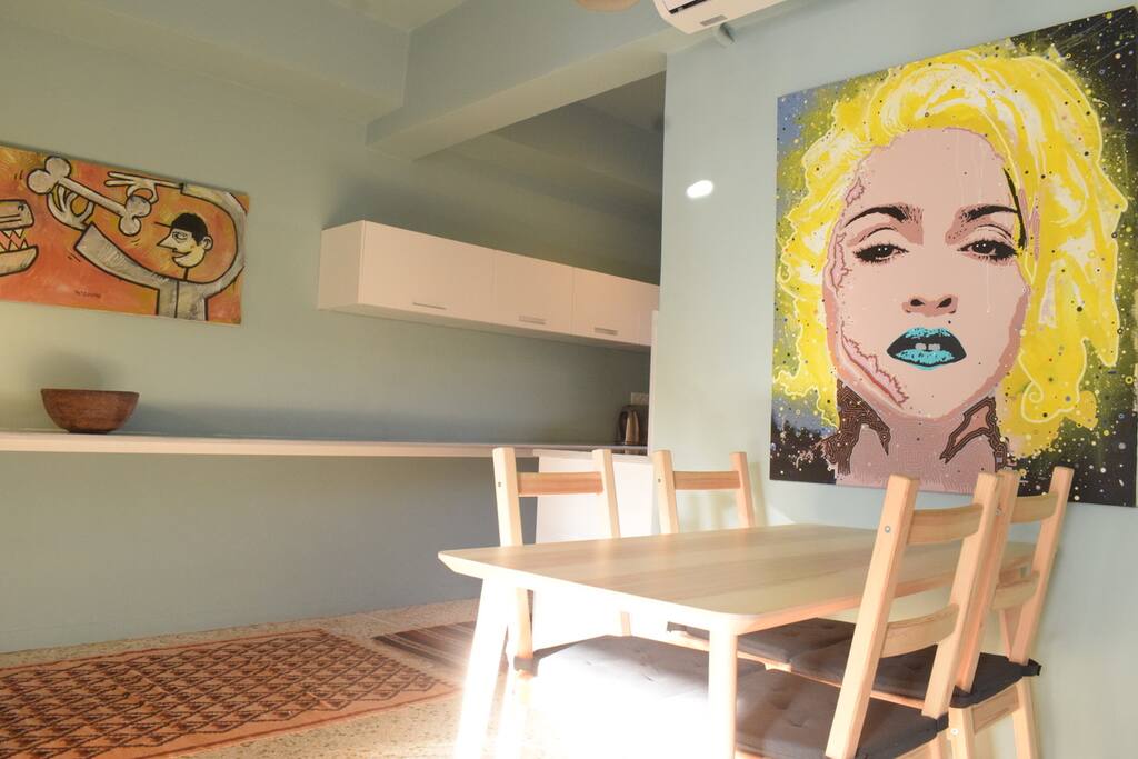 Dining area with kitchen in the background