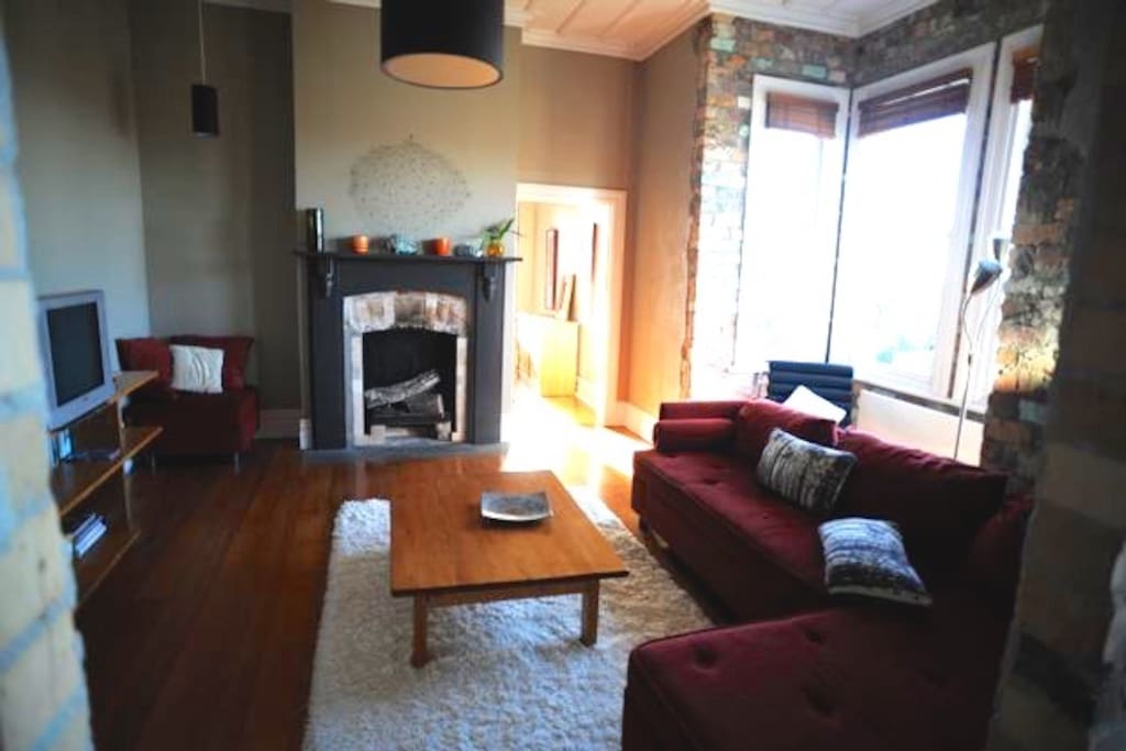Living Room with views out to park and cityscape (open to Kitchen)