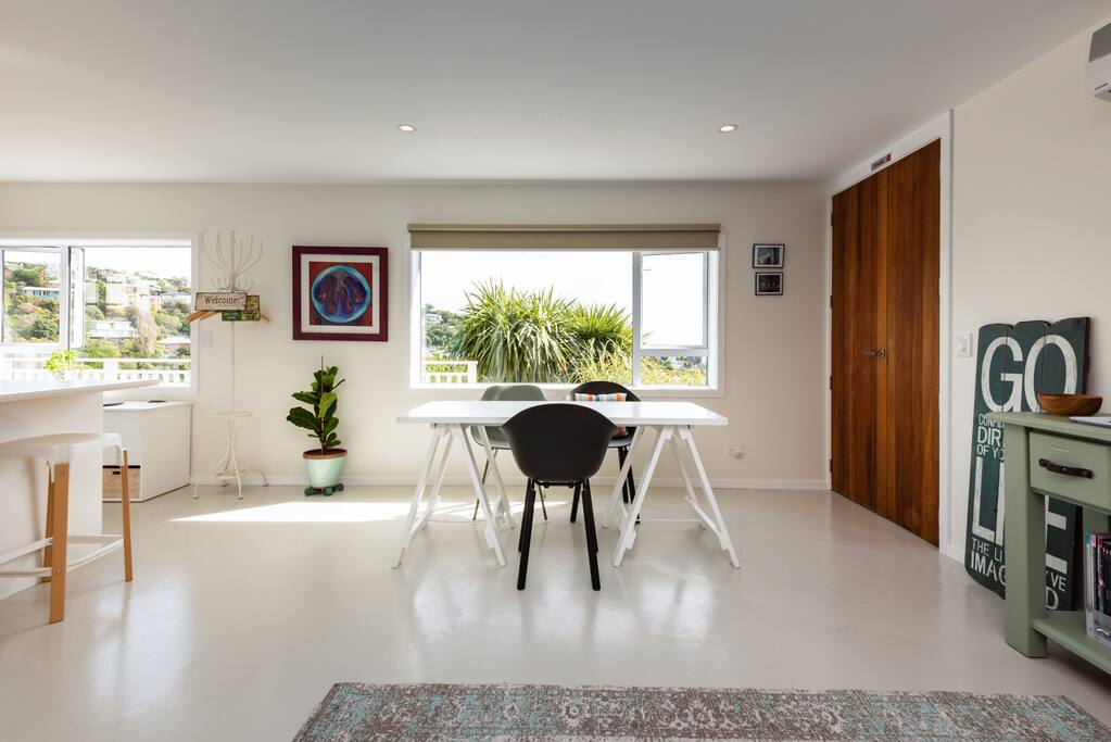Spacious living area for dining, working, hanging out together.