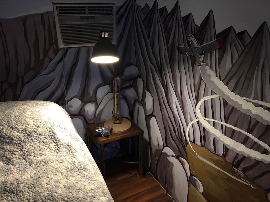 The tiny spot has a beautiful airplane-themed mural by local artist.