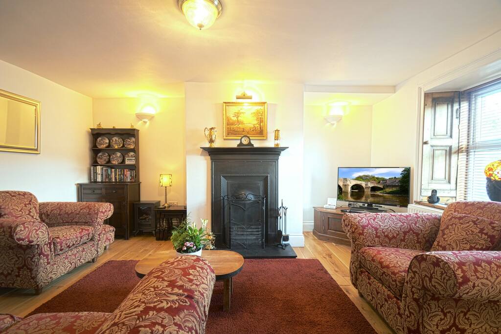 The Living Room in Riverside Cottage features a character open fire, 40" LCD TV and DVD Player and comfortable seating for four people.