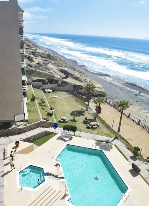 From our deck: Pool, picnic area, volley ball court, beach south.