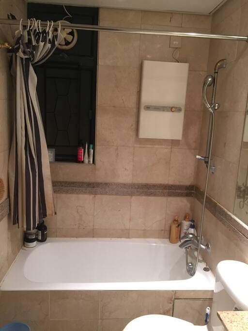 Clean bathroom with bathtub