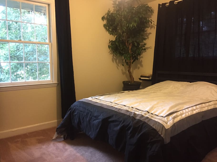 Cozy second bedroom with a clean cut and elegant vibe containing a new foam mattress with a fluff top that’s sure to make your stay a relaxing one. Your own ceiling fan is hanging above to complement the central air conditioning.