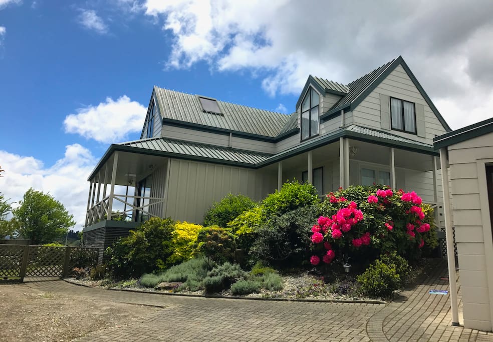 Beautiful sunny gardens with wrap around deck.