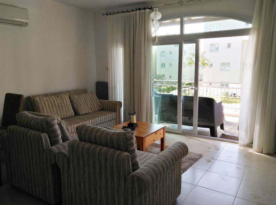 Living room and balcony with sea views.
