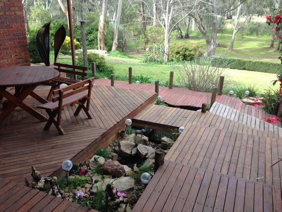 Wooden deck with water feature.