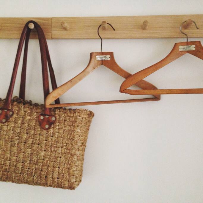 There is a small clothes rail and hooks and hangers and