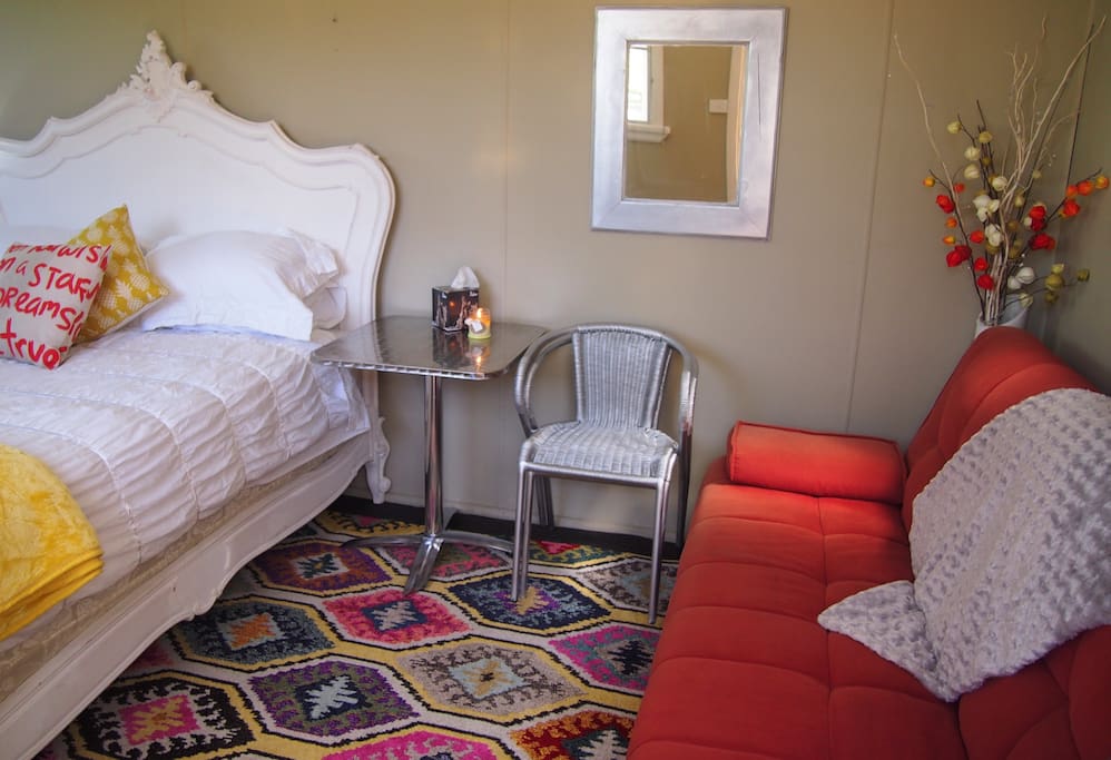 Bedroom one is a cabin with queen Anne Bed & click-clack couch & two seater cafe table can sleep up to four people