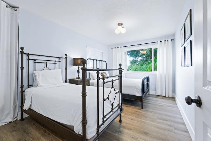The 1st bedroom includes a queen bed and twin bed