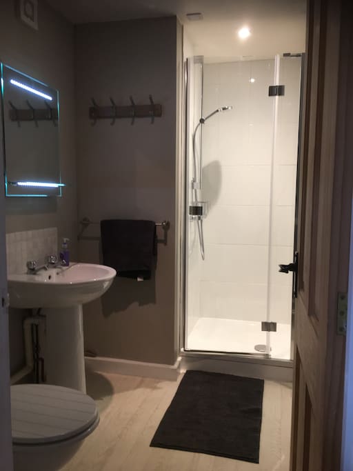 The bathroom with heated towel rail, mirror with demister pad, shaving point and sensor light. New shower with good pressure.
