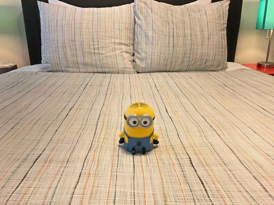 Bedroom with Queen bed and our luxury mattress, high thread count sheets, and luxury pillows. Hey is that a Minion there too? ;)