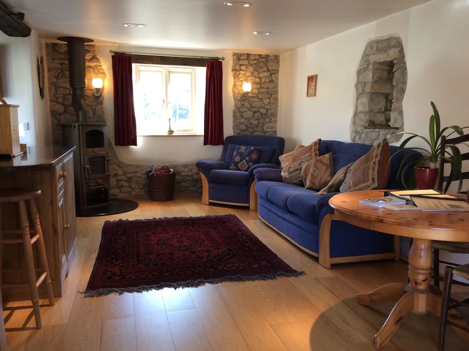 Lounge area with views to the gorge, a lovely wood burning stove