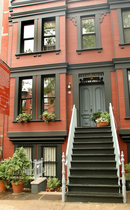 Facade of Main House. Guests enter under stairs thru their own door, away from the main traffic of house, assuring more privacy.
NYC LANDMARKS SIGN IS ON THE LEFT.
