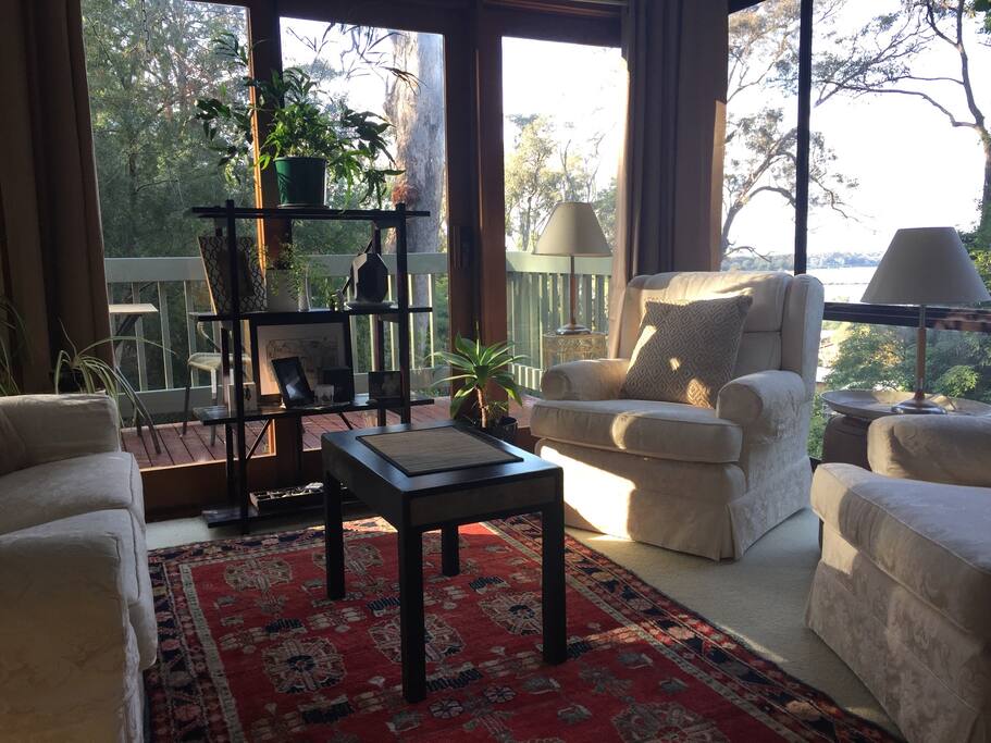 Large picture window that captures a view of lake and beyond