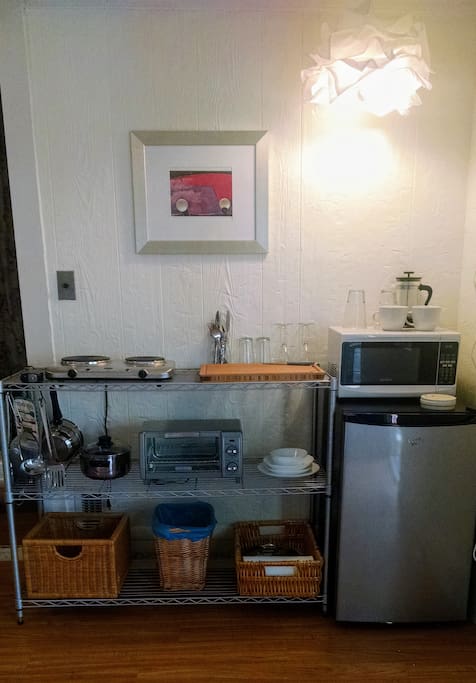 Efficiency kitchen includes 2-burner stove, mini-fridge, toaster oven and microwave